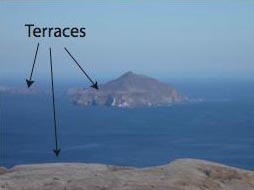 Figure 1: View of Anacapa Island from the Eastern end of Santa Cruz Island. The land in the foreground is a marine terrace on Santa Cruz Island. The same age terrace is the flat portion on the near side of Anacapa Island.