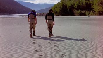 two people standing in the Chitina desert
