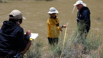 Collecting plant data along the transect .(Photo_ George Snyder)