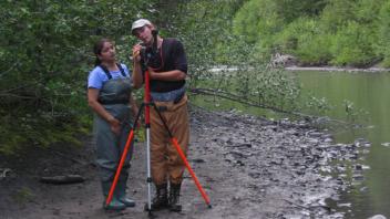 Evan giving Shruti a tutorial on the laser level