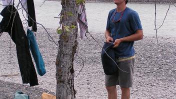 Evan performing a smell test on his laundry