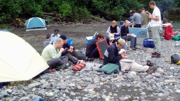 group of people working at creek