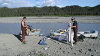 Two people organizing fishing gear