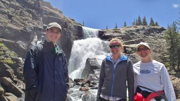 three people smiling
