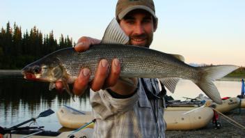 person holding fish
