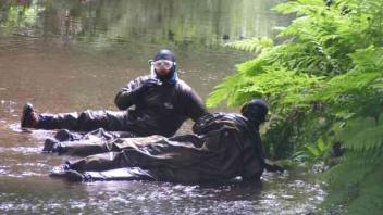 people in creek