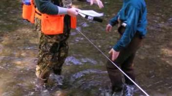 people in creek