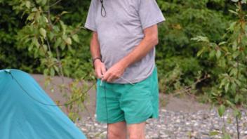 Peter carefully getting ready to stake down his tent