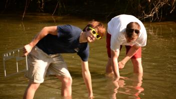 2 people in creek