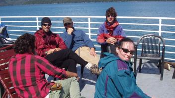 group of people chatting on deck
