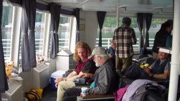 group of people chatting on boat