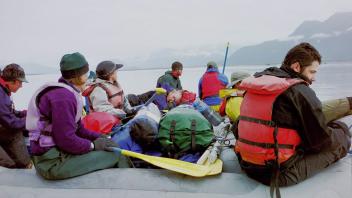 group of people on raft